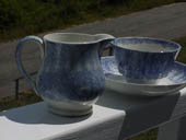 Reliefs Milk Pitcher and Cup and Saucer